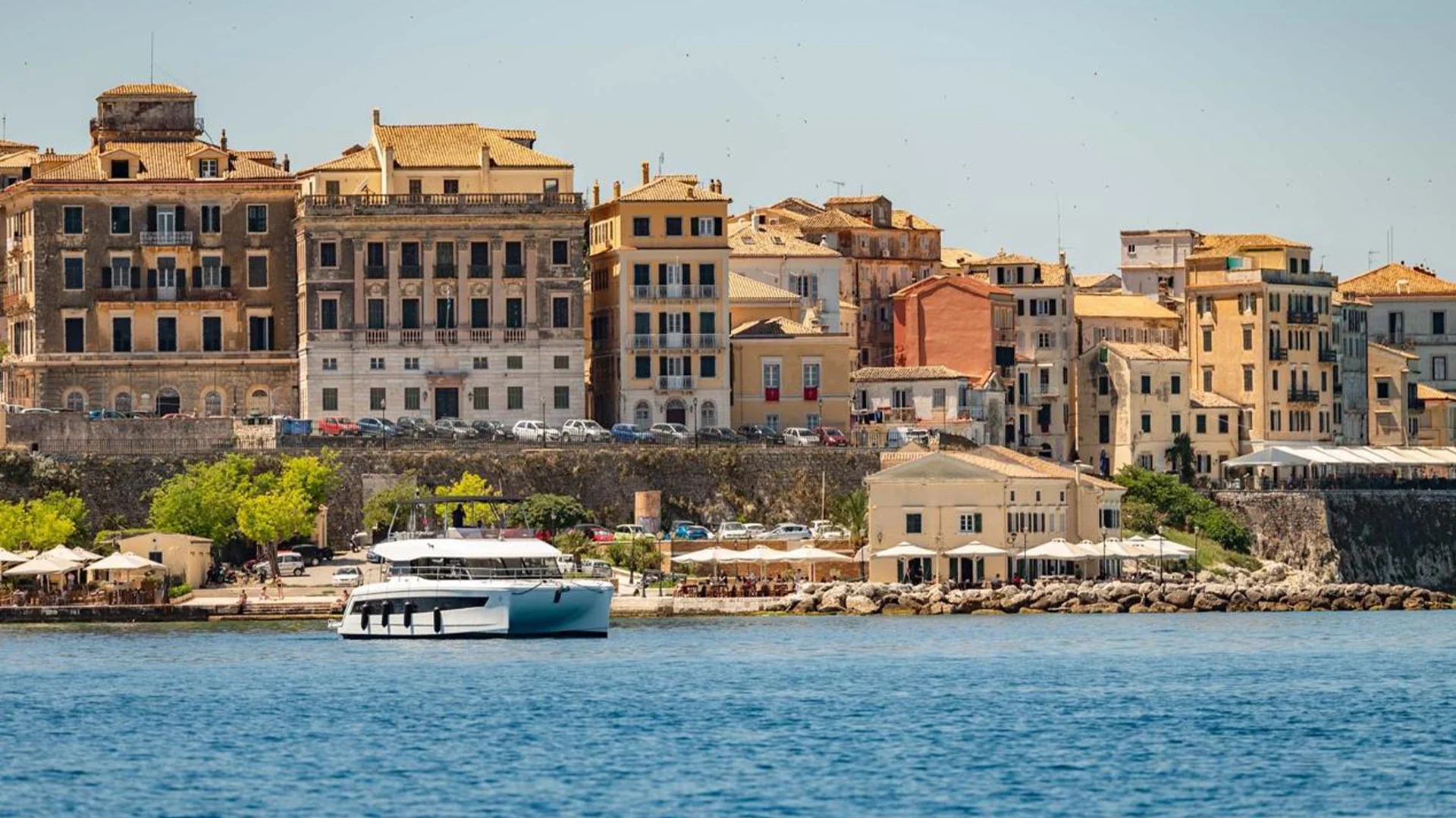 Historic Corfu old town waterfront with pastel buildings