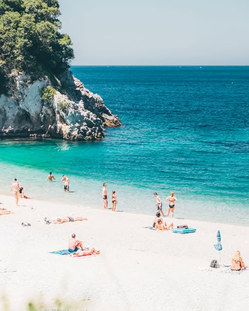 Turquoise cove and white sand beach in Corfu